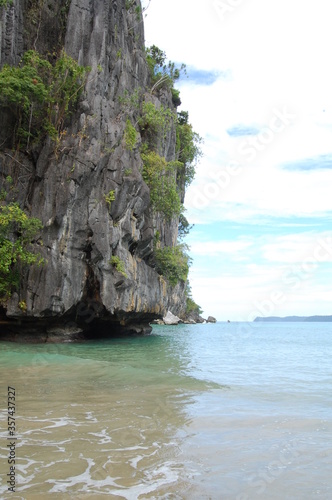 Limestone rock formation with trees and sea at Puerto Princesa, Palawan, Philippines