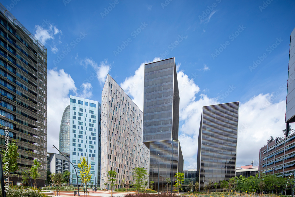 skyscrapers with clouds in sky, Barcelona, Spain skyscrapers with clouds in sky, Barcelona, Spain