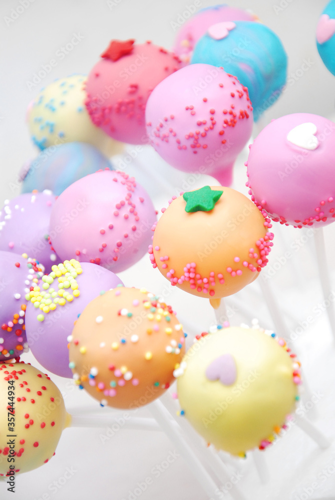 colorful cake pop , yellow, blue, pink and purple