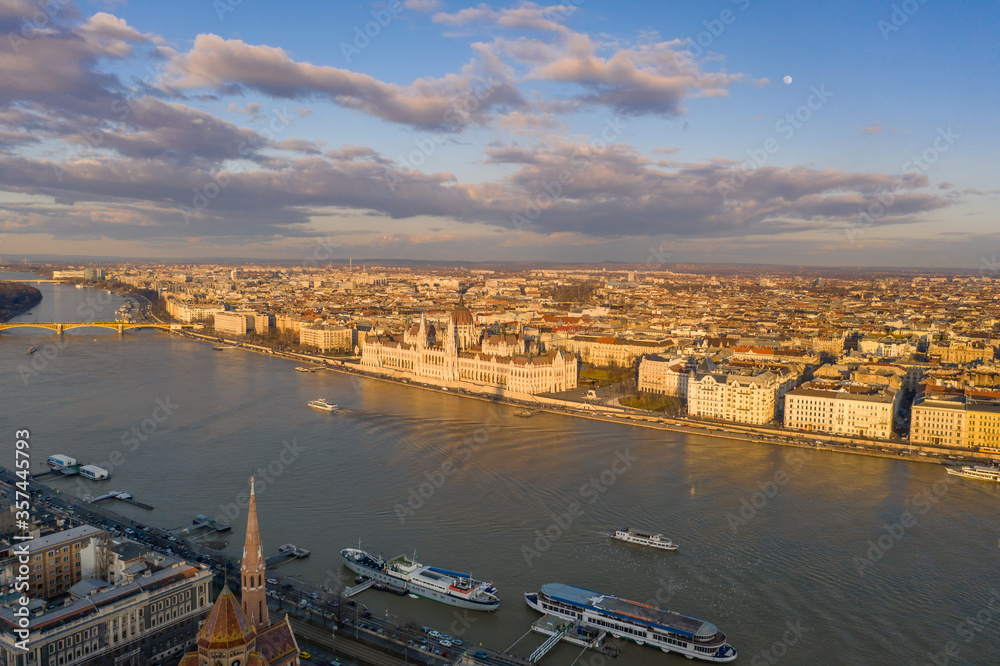 Aerial drone sunset view of Hungarian Parliament by Danube river in Budapest