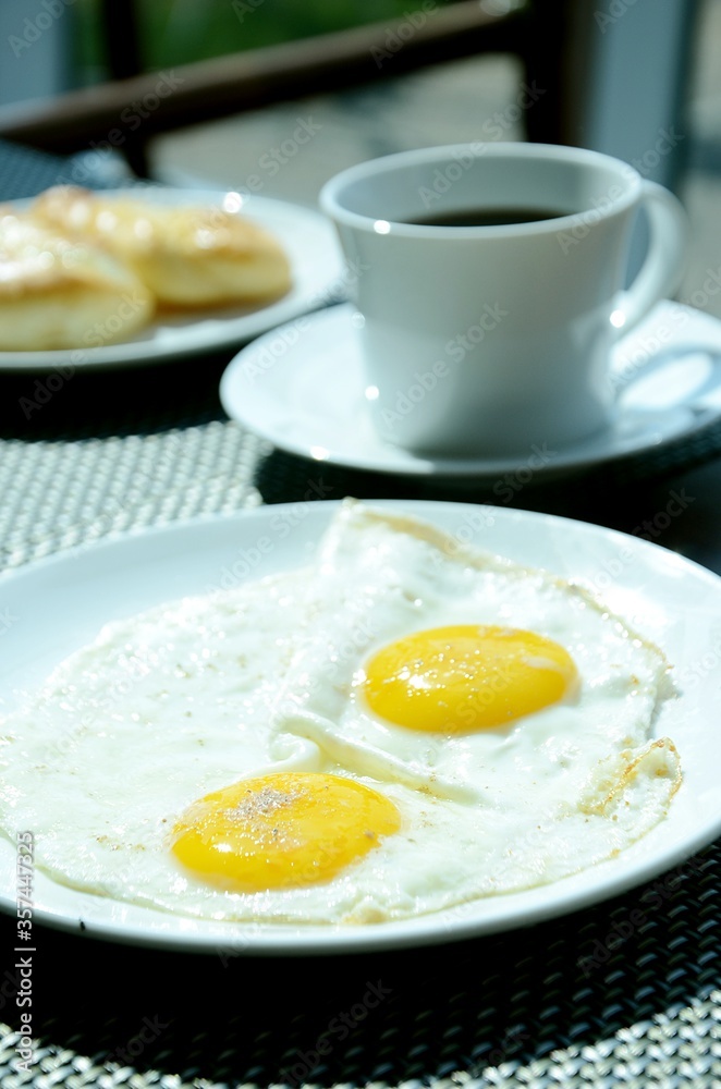 breakfast with fried eggs and a cup of coffee breakfast with fried eggs and a cup of coffee