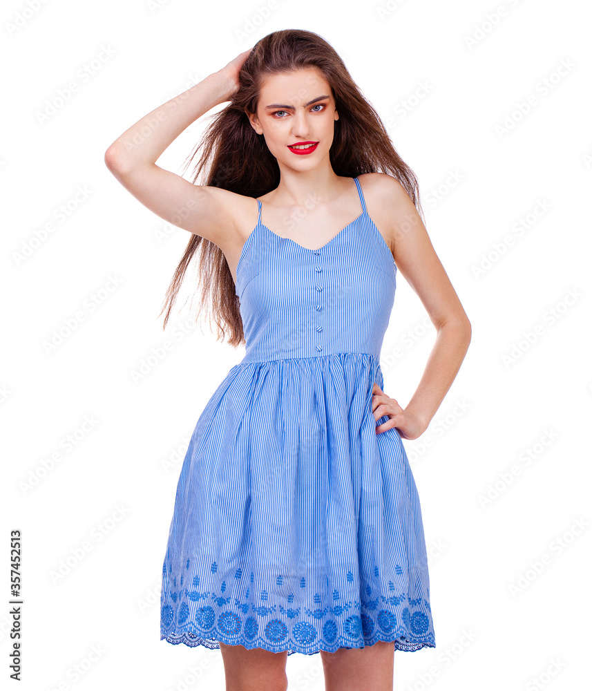 Fashion portrait of a young beautiful woman in dress