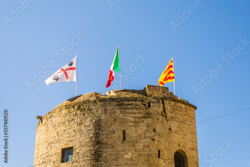 Tower with flags in Alghero (Sardinia, Italy). photo