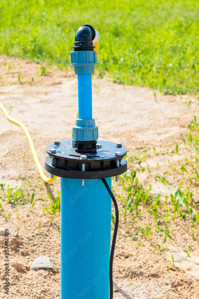 bright lighting. equipped well under water. Their PVC pipe is blue. Close-up bright lighting. equipped well under water. Their PVC pipe is blue. Close-up