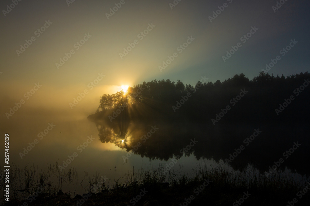 Foggy morning. Morning fog on the lake.