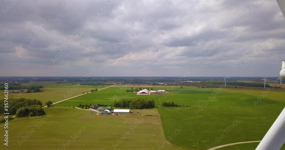 Aerial flying closely past wind turbine blades. Aerial flying closely past wind turbine blades.