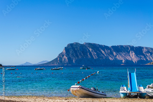 Boats in front of the Isola Tavolara  Olbia  Sardinia  Italy .