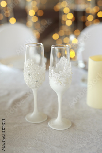 beautiful white wine glasses on the festive table