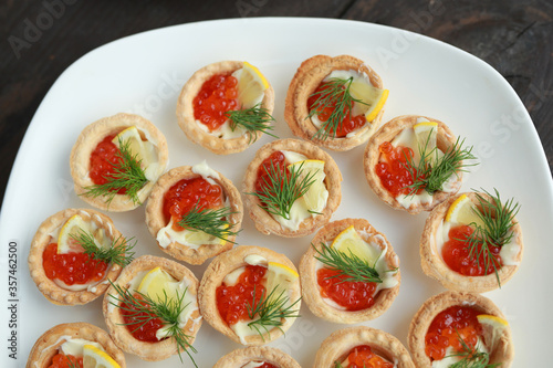 beautiful tasty tartlets with red caviar