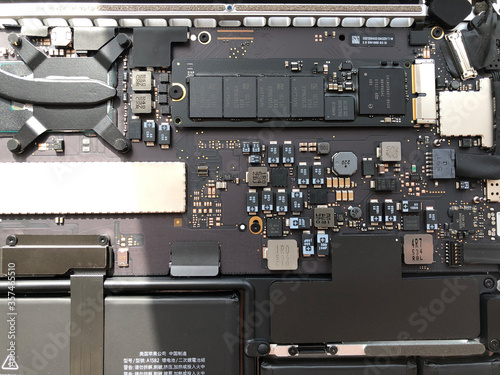 Notebook Internal Parts. Laptop repair. Disassembled computer parts. PC electronic components. Closeup of motherboard and cpu photo