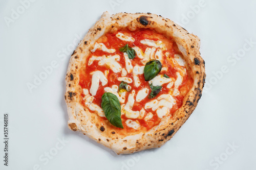 Italian pizza on a white background. Top view.