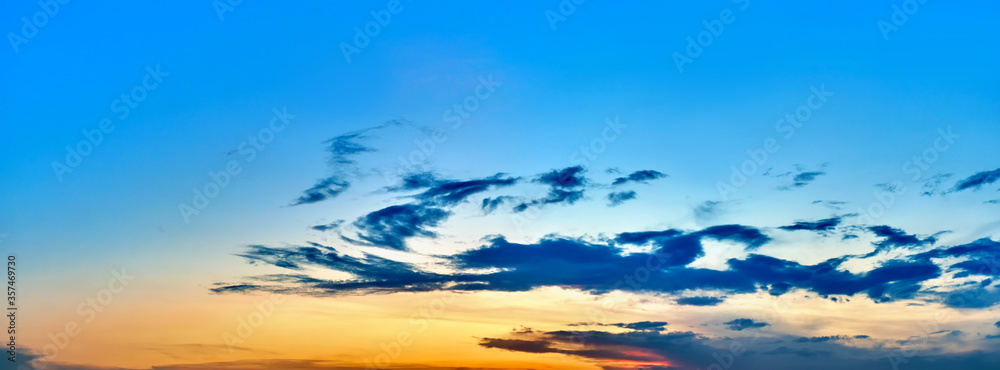 picturesque sky landscape background at sunset natural color of evening cloudscape panorama with sun below horizon ultra wide panoramic view