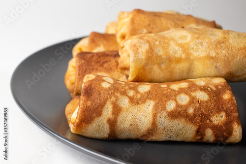Pancakes on wheat flour. Sweets, sweet breakfast - baking pancakes.