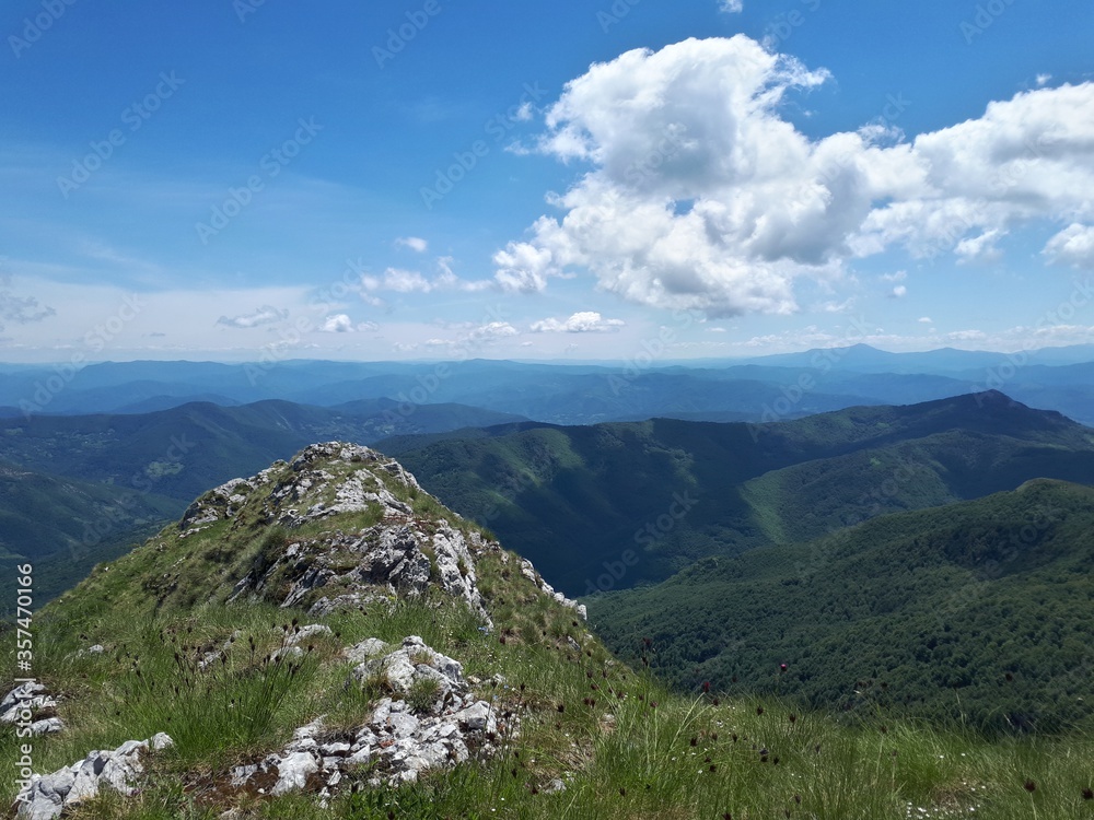 Naklejka premium mountain landscape with clouds