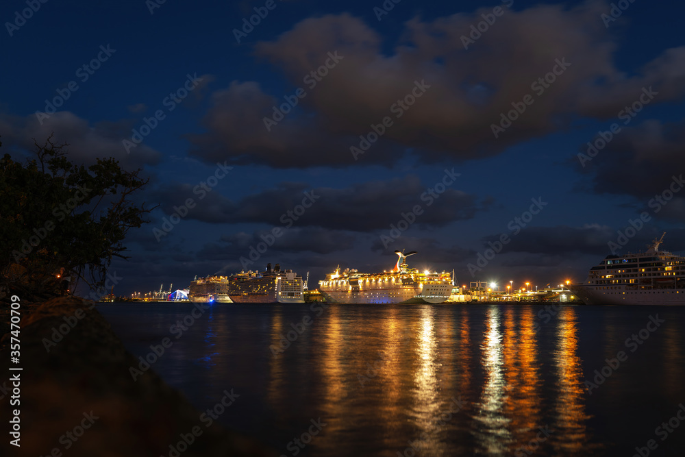 MIAMI BEACH, USA - MAY 27, 2020: Night view of cruise liners near Miami Port. Island Adventure day cruise from Miami.