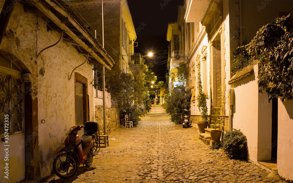 Night view of historical, old street in old town of Cunda (Alibey) island.