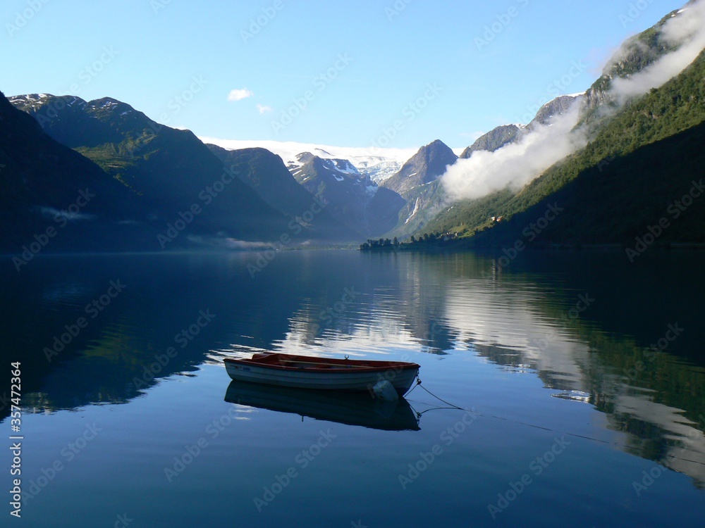lonely boat on a mountain lake