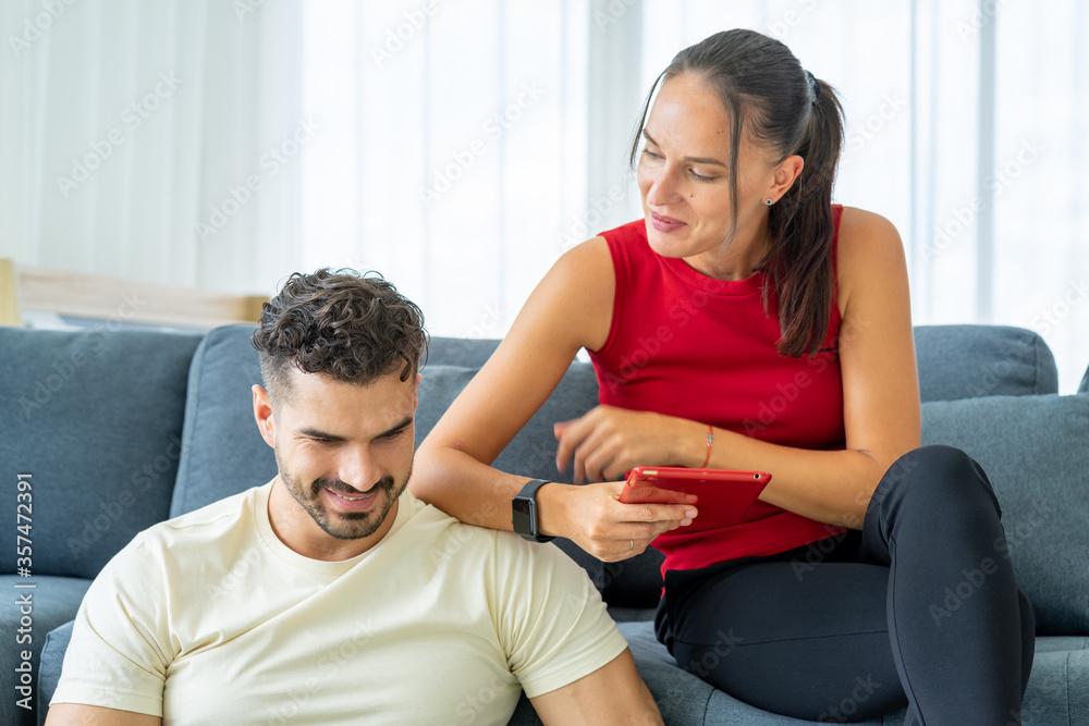 caucasian young businessman having social distancing meeting by video call conferfence from his notebook work from home with his attractive girlfriend caucasian young businessman having social distancing meeting by video call conferfence from his notebook work from home with his attractive girlfriend