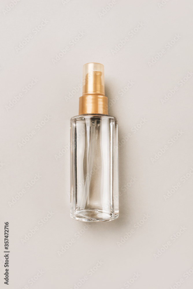 A bottle with a cosmetic product for skin or hair care. Flat lay, top view. A bottle with a cosmetic product for skin or hair care. Flat lay, top view.