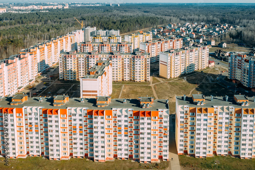 Gomel, Belarus. Aerial Bird's-eye View Of New Residential Multi-storey Houses. Cityscape Skyline In Sunny Spring Day. Real Estate, Development Industry photo