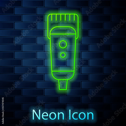 Glowing neon line Electrical hair clipper or shaver icon isolated on brick wall background. Barbershop symbol. Vector Illustration
