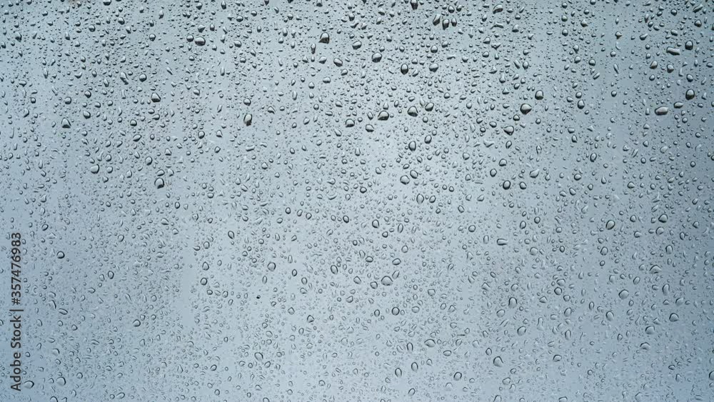 The rain drops flowing on the window. time lapse The rain drops flowing on the window. time lapse