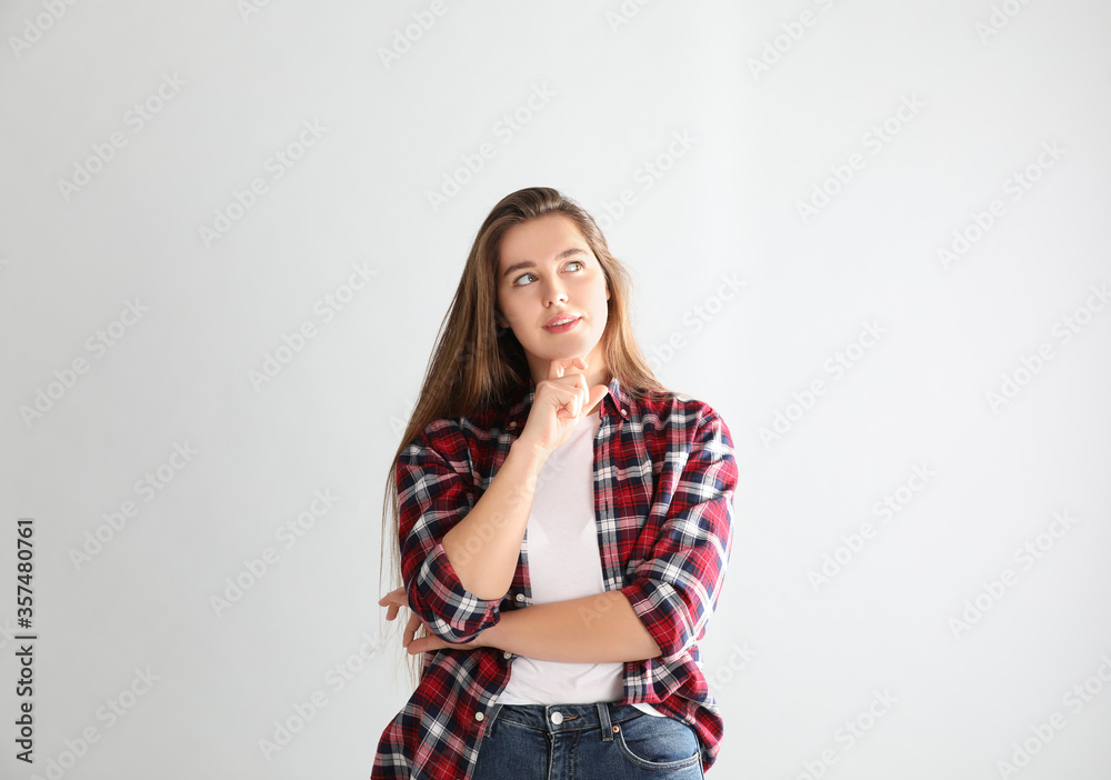 Portrait of young woman on light background Portrait of young woman on light background