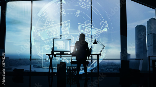 Web developer works at the computer on a background of infographics. © conceptcafe