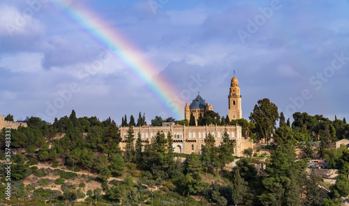 View on the Dormition Abbey, mount Zion, old city of Jerusalem with a rainbow. Israel.