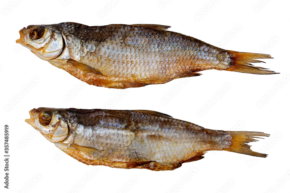 Dried roach isolated on a white background. Two fish conservation and preservation. Dried roach isolated on a white background. Two fish conservation and preservation.