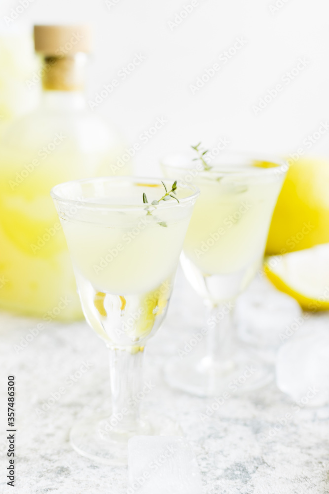 Italian traditional liqueur limoncello with thyme Italian traditional liqueur limoncello with thyme