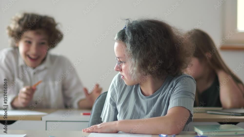 Children to the class behave impolitely, throw papers and hooligans and play pranks. Back to school, teens during class break Children to the class behave impolitely, throw papers and hooligans and play pranks. Back to school, teens during class break