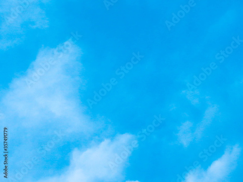 Light Blue Sky Texture with Few Clouds on Sunny Summer Day