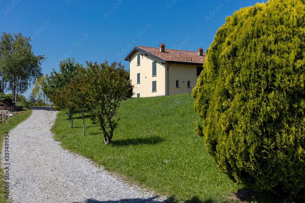 traditional Italian house with garden and blue sky background