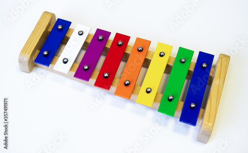 Rainbow Colored Wooden Toy Xylophone on white background