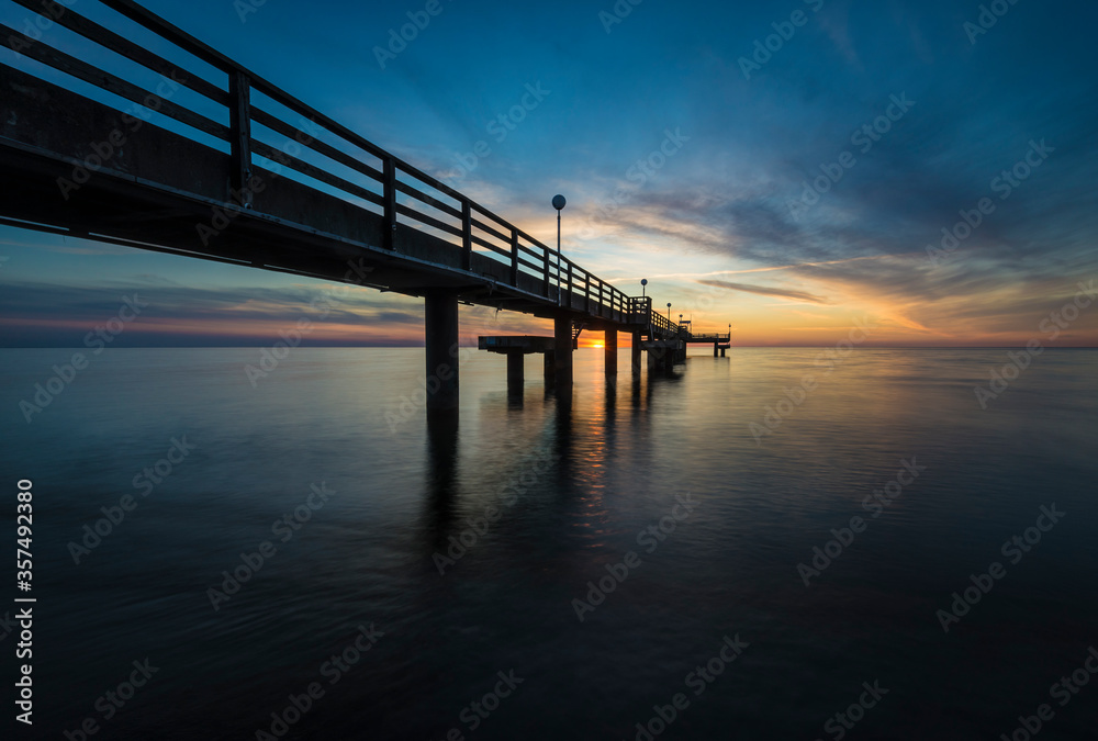 pier on the baltic sea at sunset