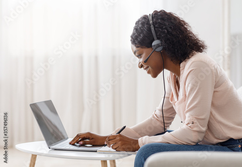 Online Education Concept. Young African Woman Studying On Laptop At Home