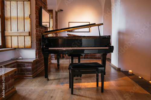 Grand piano in a rustic room