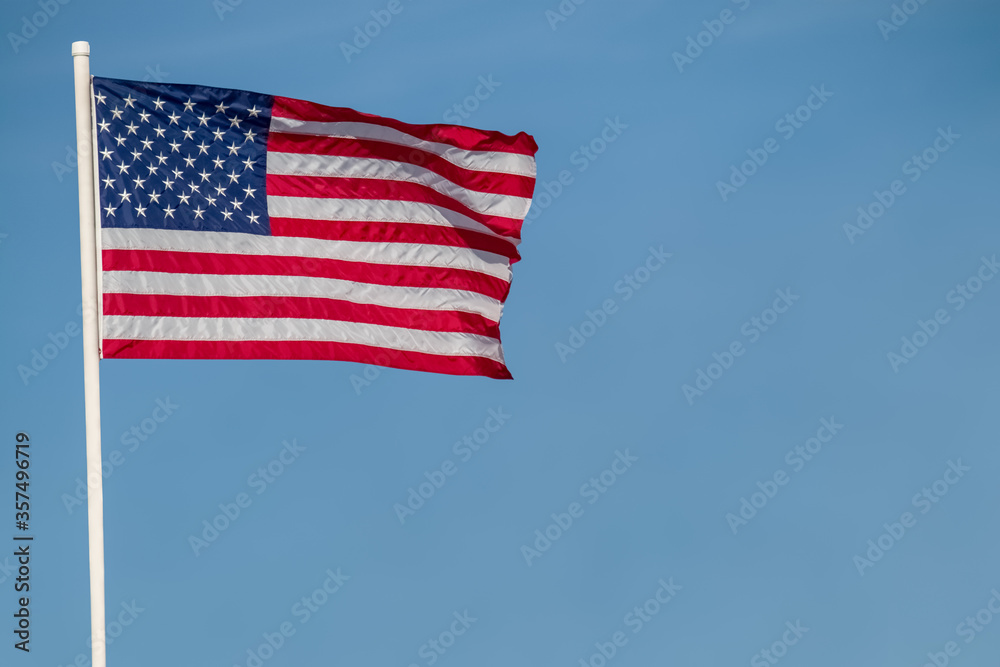 Obraz premium american flag against blue sky copy space