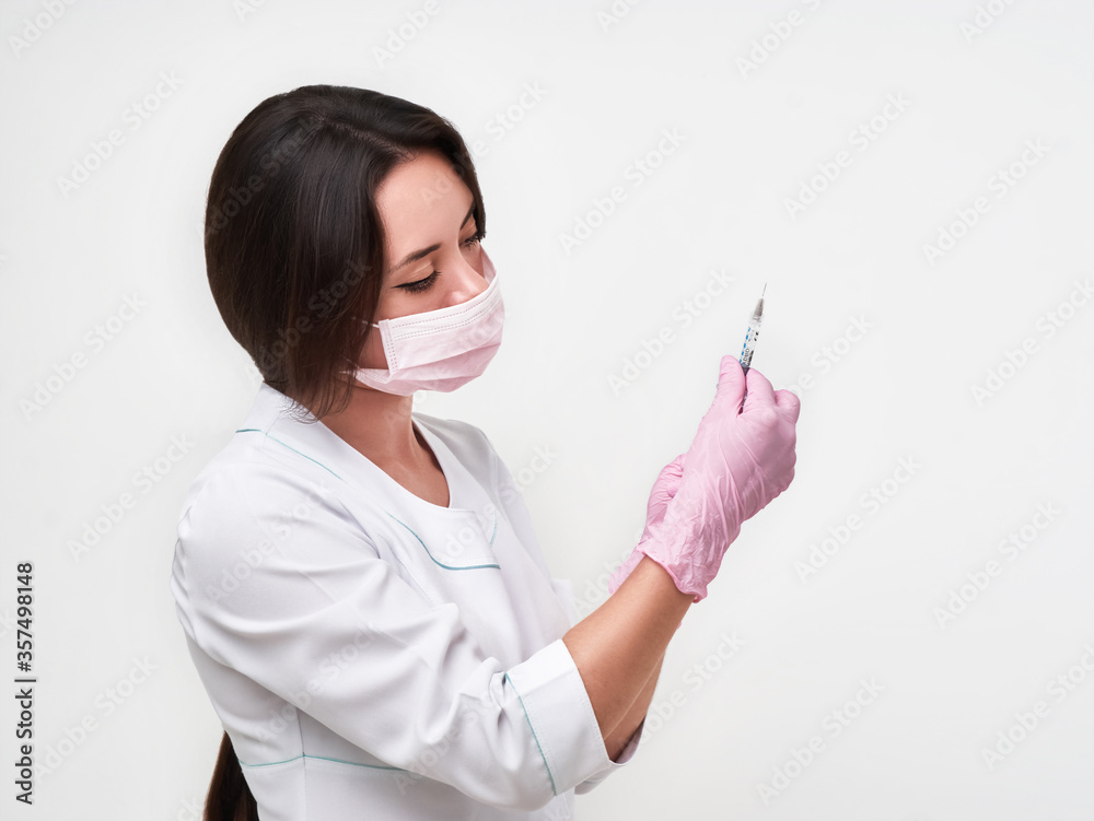 Nurse, masked doctor holding syringe isolated on white background Nurse, masked doctor holding syringe isolated on white background