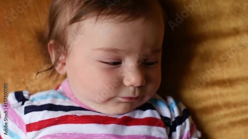 Happy baby blowing bubbles