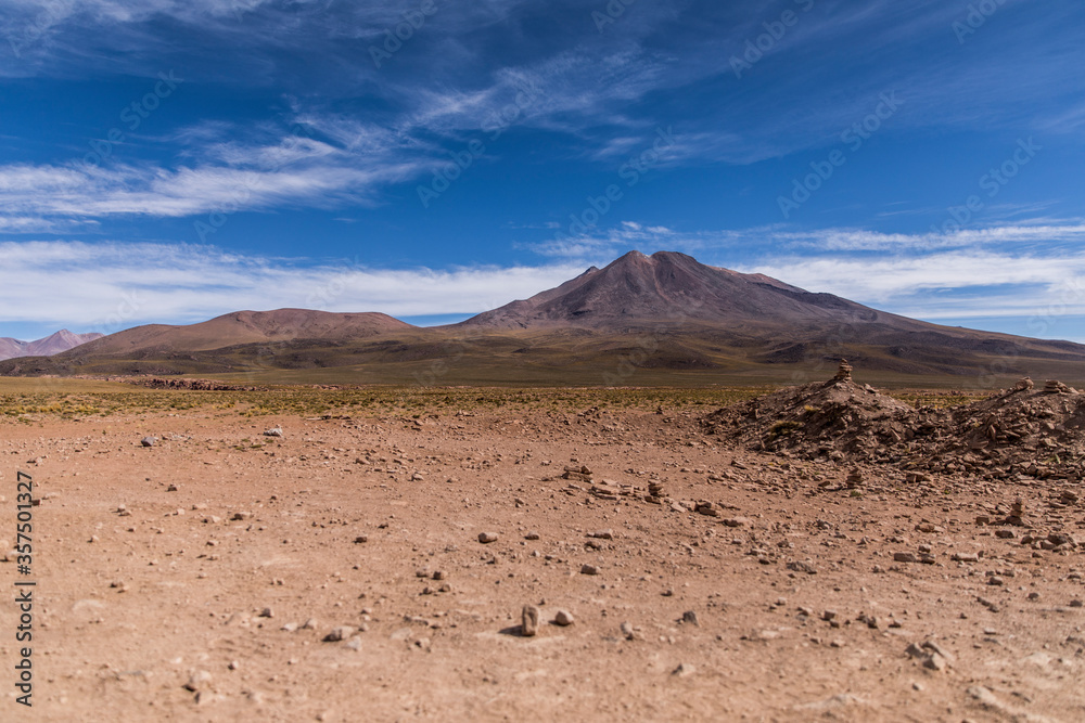 Volcano in the desert with blue sky