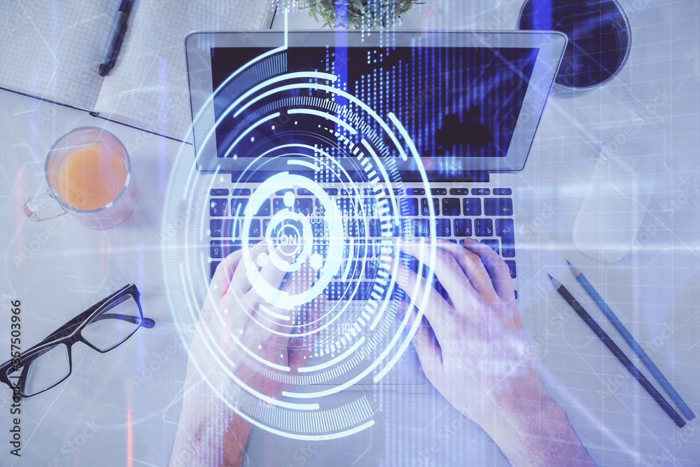 Multi exposure of man's hands typing over computer keyboard and data theme hologram drawing. Top view. Technology concept. Multi exposure of man's hands typing over computer keyboard and data theme hologram drawing. Top view. Technology concept.