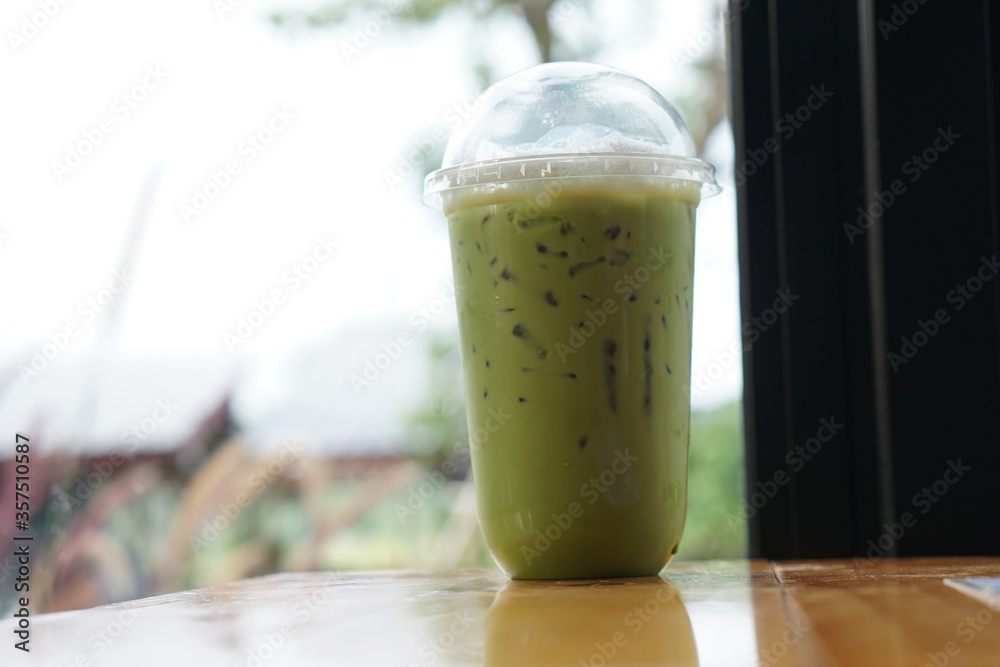 cup of green tea smoothie on the coffee shop table cup of green tea smoothie on the coffee shop table