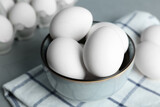Chicken eggs in bowl on table, closeup