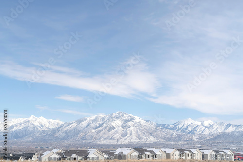 Striking Wasatch Mountains and South Jordan City in Utah during winter season