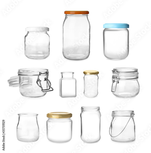 Set with different empty glass jars on white background