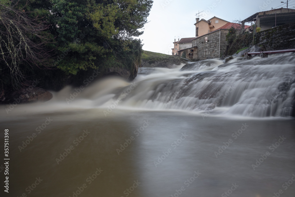 Heavy rain makes a great waterfall on the Pavia River , Viseu , Portugal