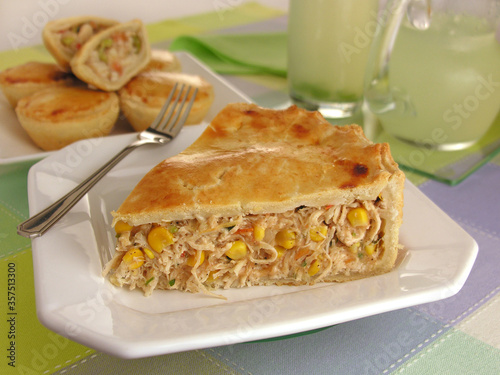 chicken pie with corn and in the background, palm heart pies with vegetables