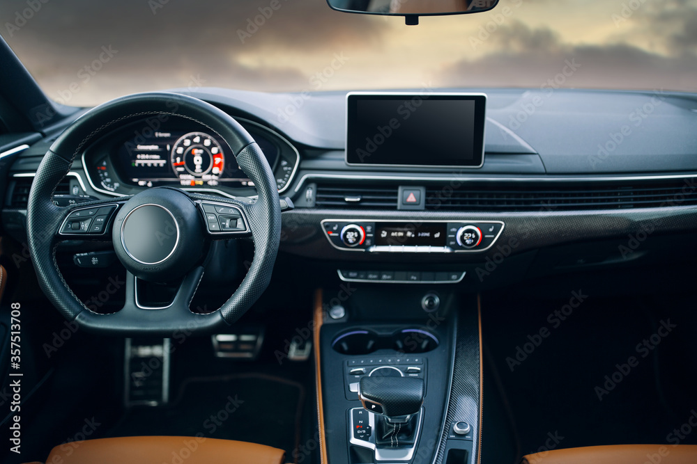 Naklejka premium Modern car interior with leather panel, multimedia and dashboard